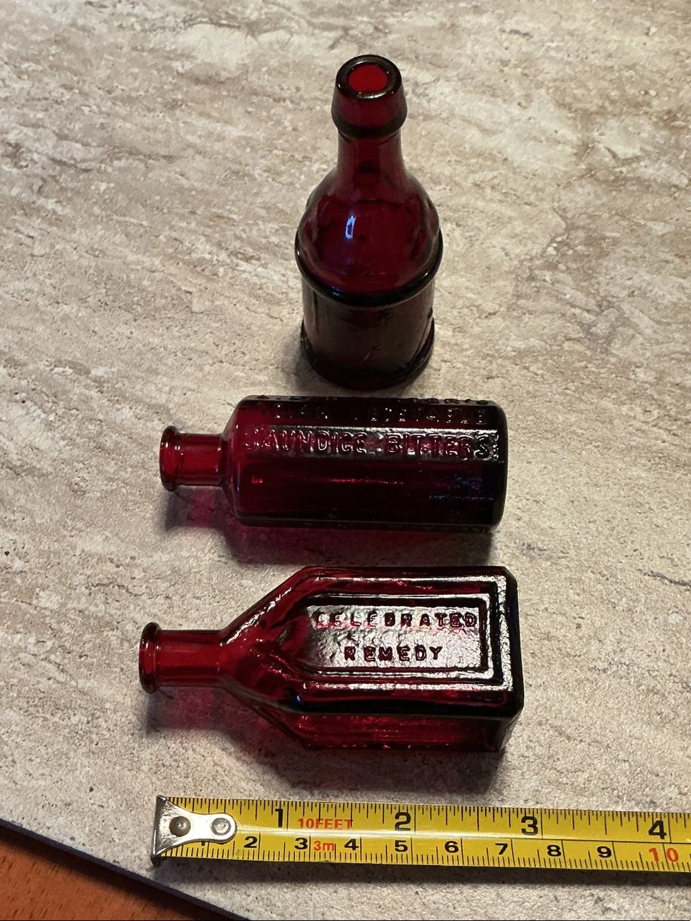 Set of 3 vintage Wheaton celebrated remedy ruby red bitters bottles.